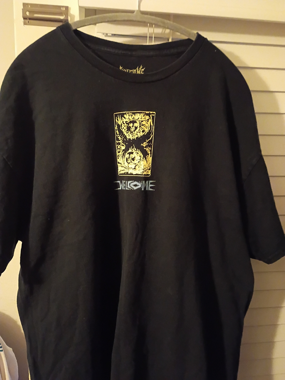 Black Welcome Skateboard Graphic Tee with Yellow Center Print